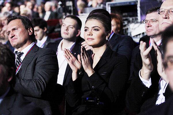 MOSCOW, RUSSIA - NOVEMBER 27: Russian politician and former Olympic Champion, Alina Kabaeva, aplauds as Prime Minister Vladimir Putin (not pictured) delivers his speech at the congress of the United Russia Party November, 27, 2011 in Moscow, Russia. Putin accepted the nomination to return to Russia's presidency ahead of the election in March. (Photo by Sasha Mordovets/Getty Images)